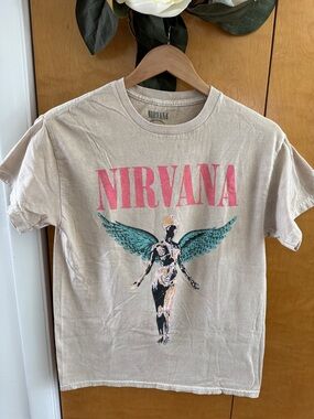 NIRVANA Beige Graphic Tee with Pink Logo and Teal Wings